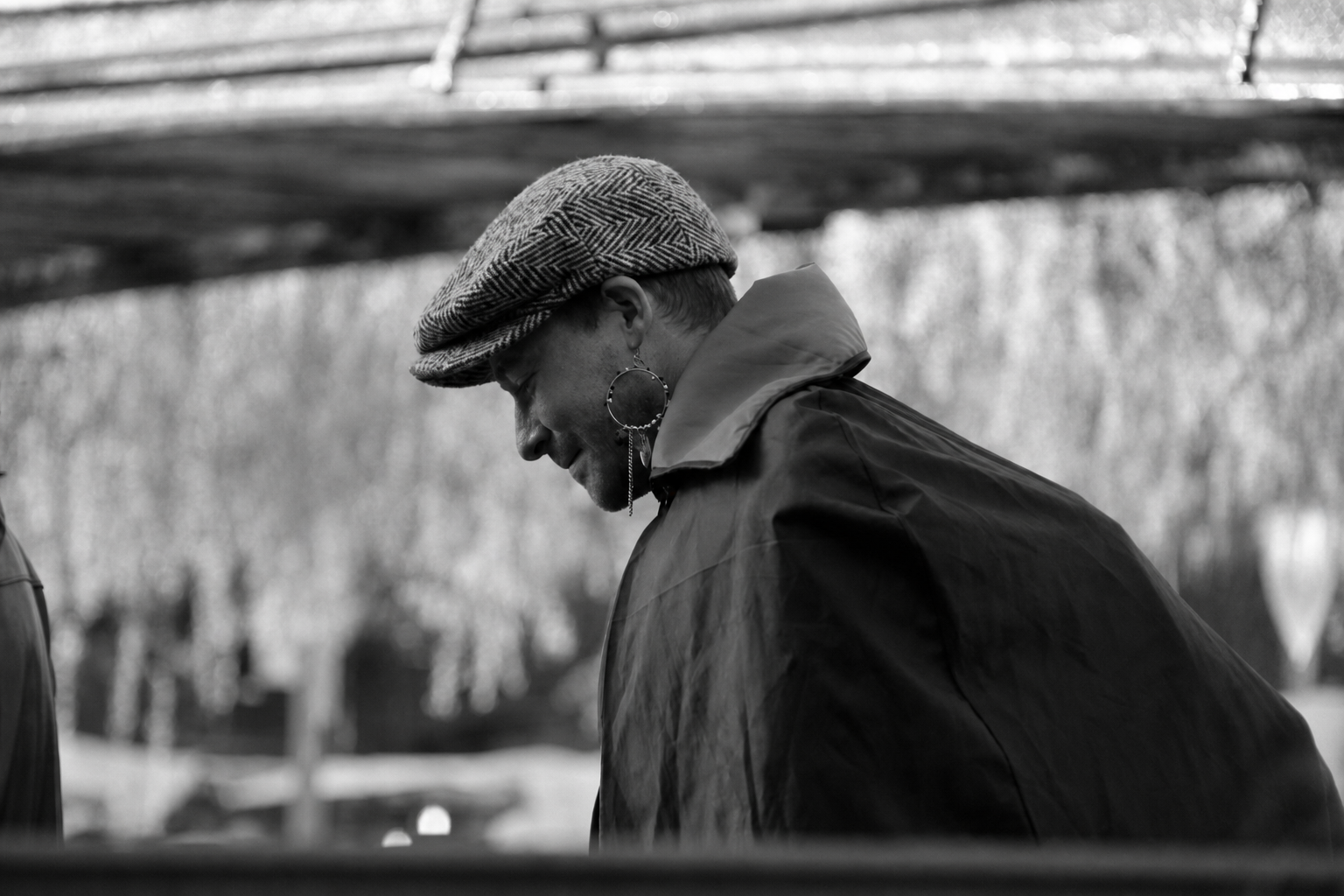 Figure in profile wearing a patterned cap
