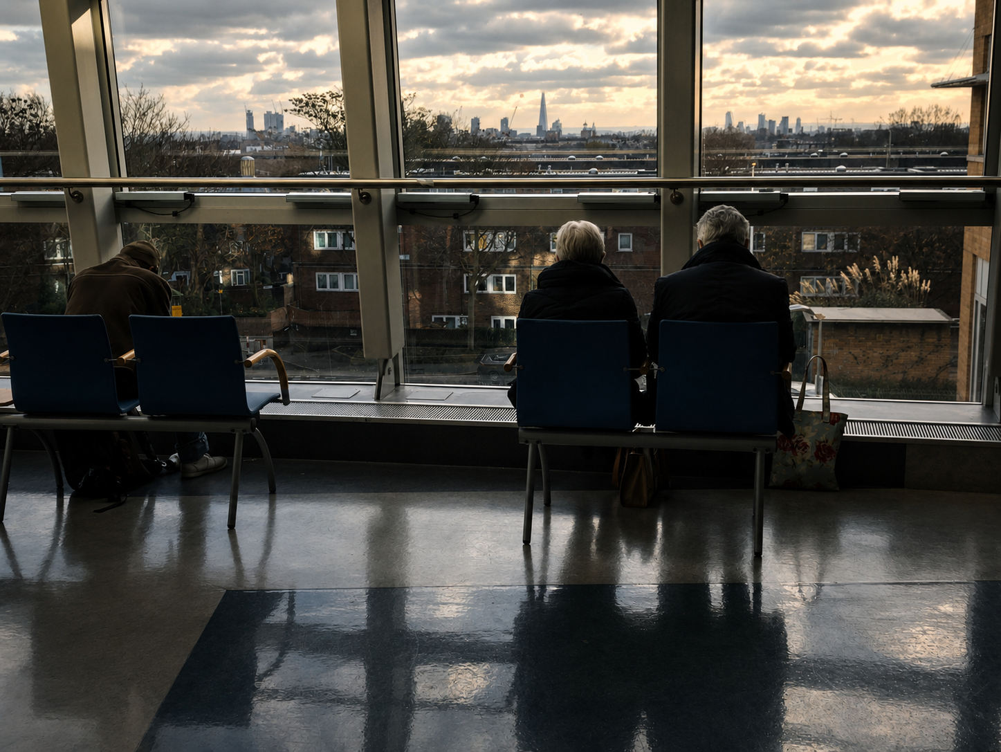 People seated before the London skyline