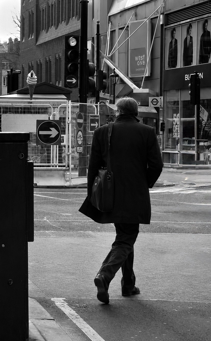 Pedestrian moving through a field of directional signs